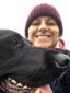 Chan from Happytailz, founder and professional dog walker in Wells, Somerset, smiling with a dog.